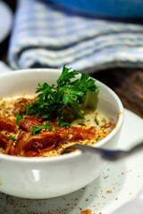 Crab and corn bisque or chowder in blue and white crockery.