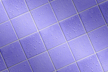 angled bath tiles background with bright joints and water droplets, wet tiled colorful background...