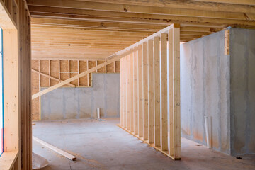 During construction is support beams built house with wooden framework frame in under construction