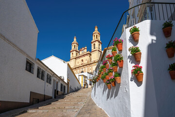 Church of Nuestra Senora de la Encarnacion and Stairs with Flowerpots - Olvera, Andalusia, Spain © diegograndi