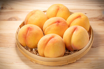 Golden Peach fruit on wooden background, Fresh Yellow Peach.