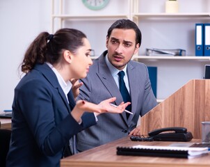 Two employees working in the office