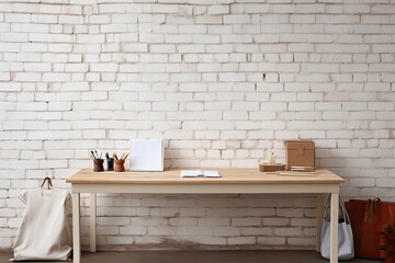 There is a clear view of a simple desk in the front, along with various designer tools placed on top of it, all set against a white brick wall. There is also empty space available to display products.