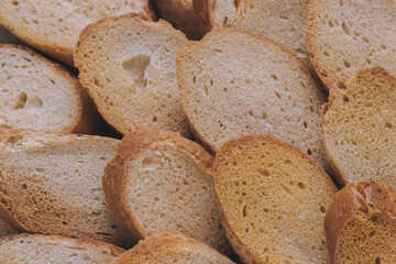 Delicious croutons. Pieces of roasted white bread. Macro shot. Sliced bread.