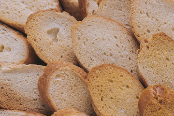 Delicious croutons. Pieces of roasted white bread. Macro shot. Sliced bread.