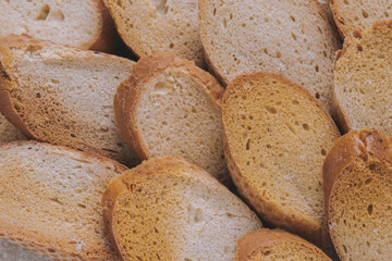 Delicious croutons. Pieces of roasted white bread. Macro shot. Sliced bread.