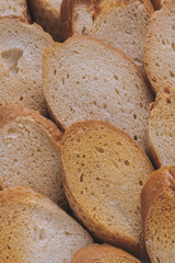 Delicious croutons. Pieces of roasted white bread. Macro shot. Sliced bread.