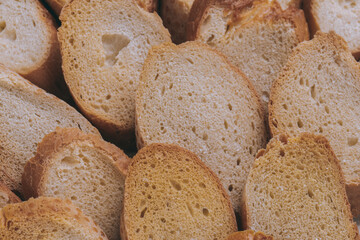Delicious croutons. Pieces of roasted white bread. Macro shot. Sliced bread.