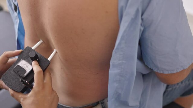 Doctor checking backbone on patient back problems Physical therapy concept