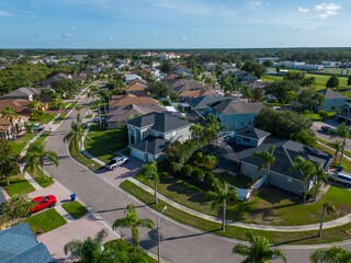 Drone photography of suburban area near Tampa Florida with green landscape and sunny sky