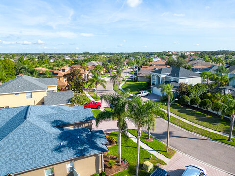 Aerial shot of residential neighborhood in Trinity Florida with houses and buildings by drone