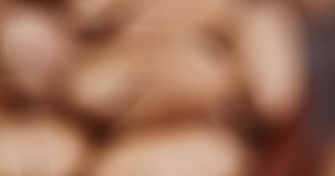 Focus on unpeeled crunchy pecans close-up, a large number of unpeeled pecans in the kitchen