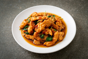 stir-fried fried fish with basil and chili in thai style