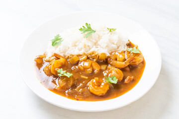 Shrimps in curry sauce on rice