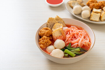 small flat rice noodles with fish balls and shrimp balls in pink soup, Yen Ta Four or Yen Ta Fo