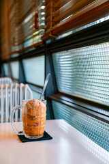 Thai tea ice scoop in glass