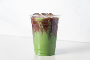 green tea matcha latte with chocolate in glass