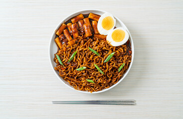 Jjajang Rabokki - Korean instant noodles or Ramyeon with Korean rice cake or Tteokbokki and egg in black bean sauce