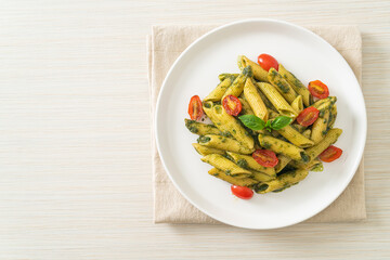 penne pasta with pesto sauce and tomatoes