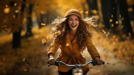 Tuinposter Woman riding bicycle at autumn forest © Daunhijauxx