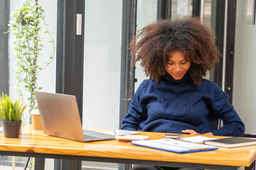 Young latin woman pregnant smiling confident touching tummy working at office