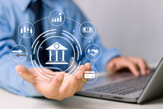 Financial innovation technology development and business management concepts, Businessman holding bank, and financial icon services that enhance success and profit in global business.
