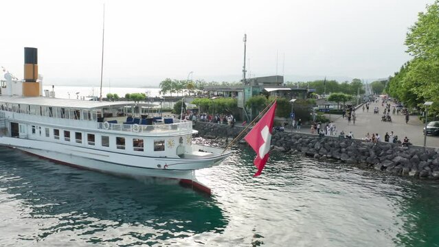 Static view of Swiss flag flying on the stern of a docked cruise ship