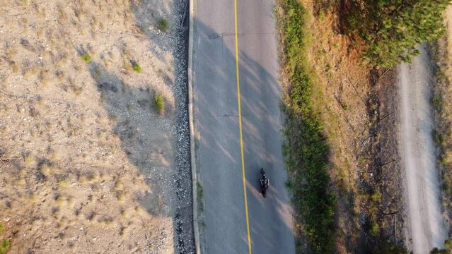 Motorcycle Driving Overlooking Okanagan Lake | Birds Eye Looking Down | Lakecountry, British Columbia, Canada | Okanagan Landscape | Scenic View | Wine Vineyard Rows | Lakeside Shoreline | Summer Time