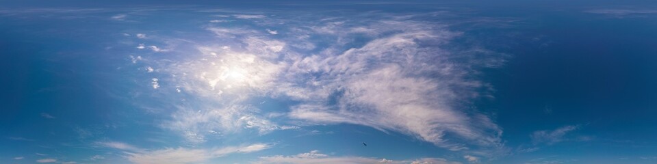 Blue summer 360 panorama of sky with clouds, no ground, in spherical equirectangular format for easy use in 3D graphics and aerial or ground composites, seamless and suitable for sky replacement.