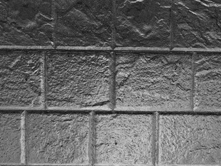 Dark brick background texture wall. Dark brick cement concrete stucco.