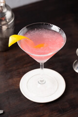 Classic Cosmopolitan Cocktail alcoholic gin, triple sec liqueur, fresh lemon juice and raspberry sugar syrup