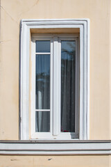 Fototapeta na wymiar Decorative old windows in red brick houses