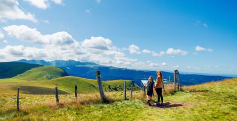Mother and son enjoying panoramic view of Auvergne,  volcanic chain- France © M.studio