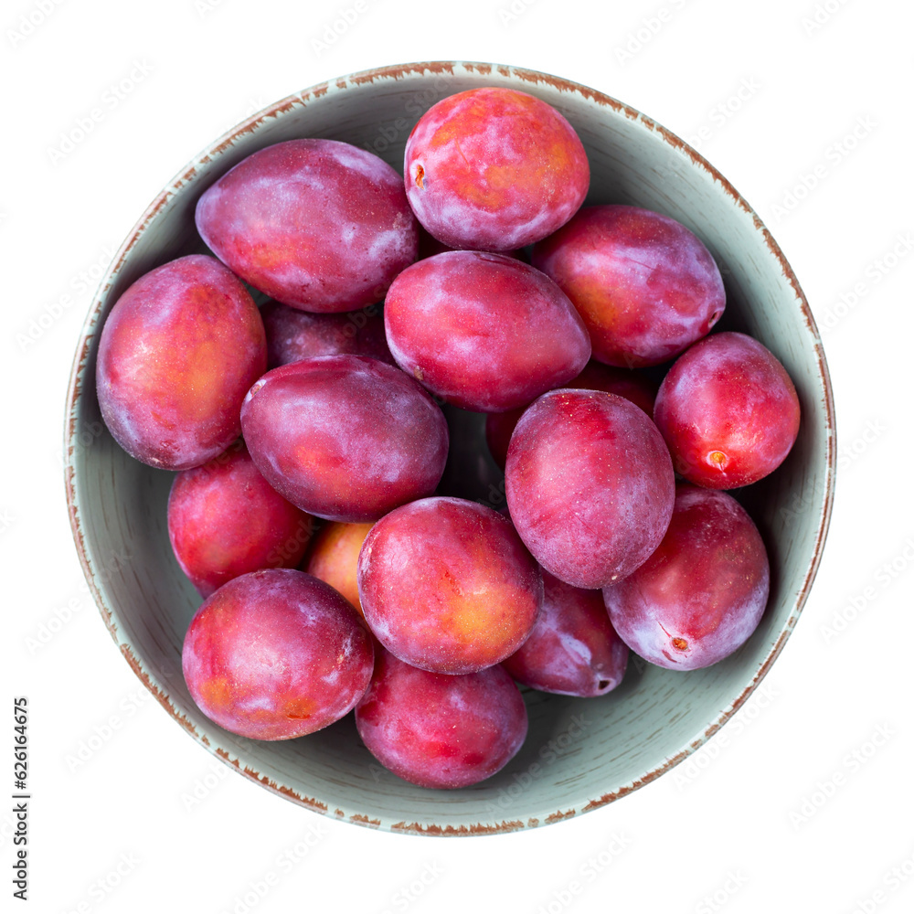 Poster ripe plums in a bowl isolated on white background. top view. file contains clipping path.