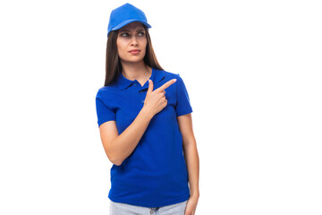 beautiful pretty young caucasian brunette woman in uniform t-shirt and cap on white billboard background
