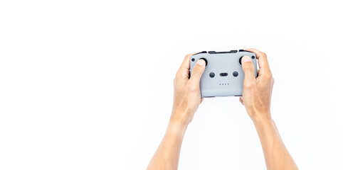 Hands holding drone controller flying drone quadcopter, Hands man controls the drone holding remote control drone aircraft. © Kalyakan