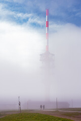 weather station on top of mountain in fog