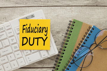 fiduciary duty text card. Finance and economy concept. finance concept. note paper