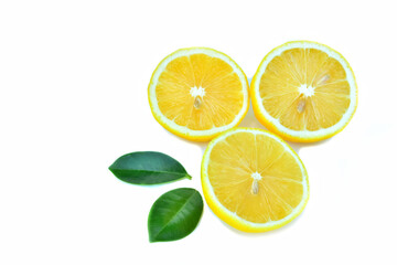 Lemon.with fresh green leaves.sliced.laying isolated.in on a white background