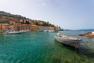 Fototapeta na wymiar A boat in a small Italian bay.