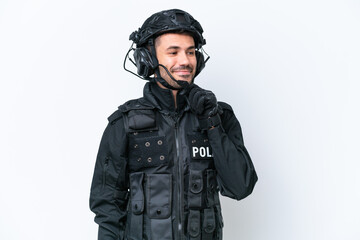Fototapeta premium Young caucasian SWAT man isolated on white background looking to the side