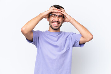 Young caucasian man isolated on white background laughing