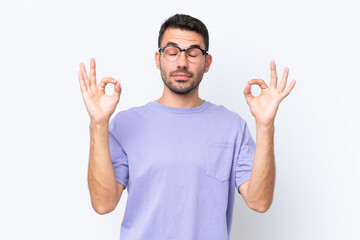 Fototapeta premium Young caucasian man isolated on white background in zen pose