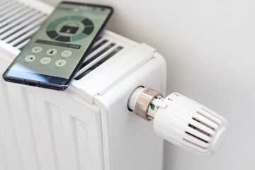 House heating with central heating. Temperature control on the radiator in the apartment on smartphone during the heating season. Thermostat. Smart home. Heating season