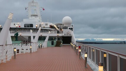 LONGYEARBYEN, NORWAY - JUNE 28, 2023: View to the ships in the port of the arctic town of Longyearbyen, Norway. Cruise ship in the port of Svalbard. Travel around the Spitsbergen archipelago.