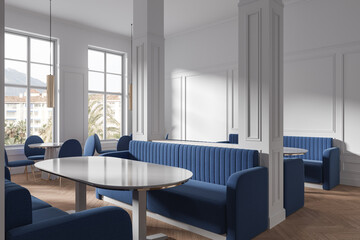 Classic white cafe interior with sofas and columns