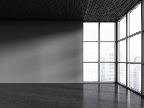 Grey empty interior room in studio flat, panoramic window on city view