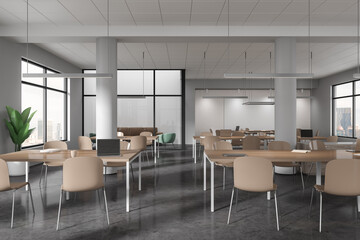 Modern office interior with desk and chairs, business coworking and chill zone