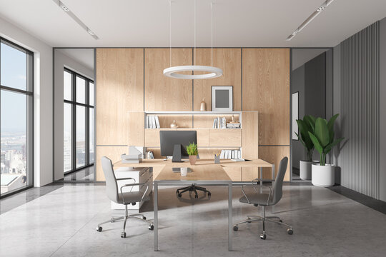 Stylish office interior with consulting zone and armchairs, panoramic window