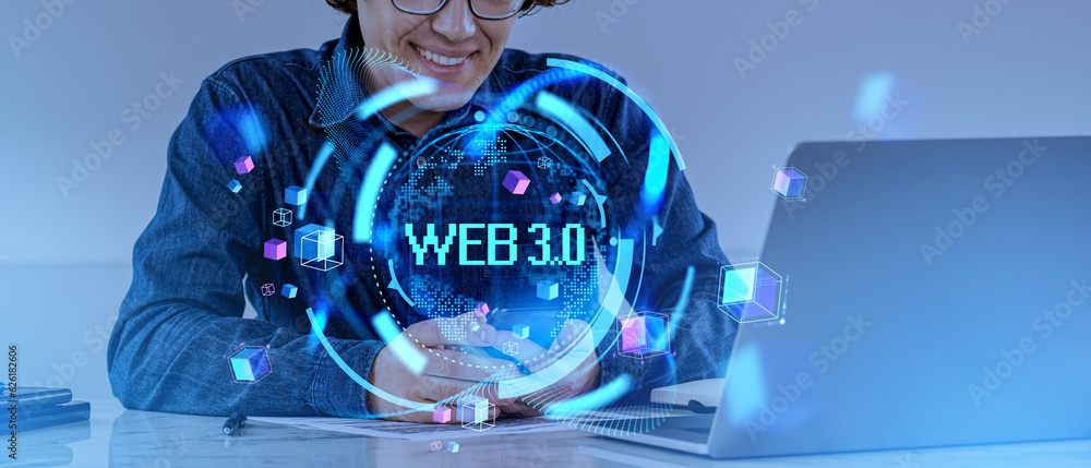 Poster smiling man with laptop and smartphone in office and web 3.0 hologram